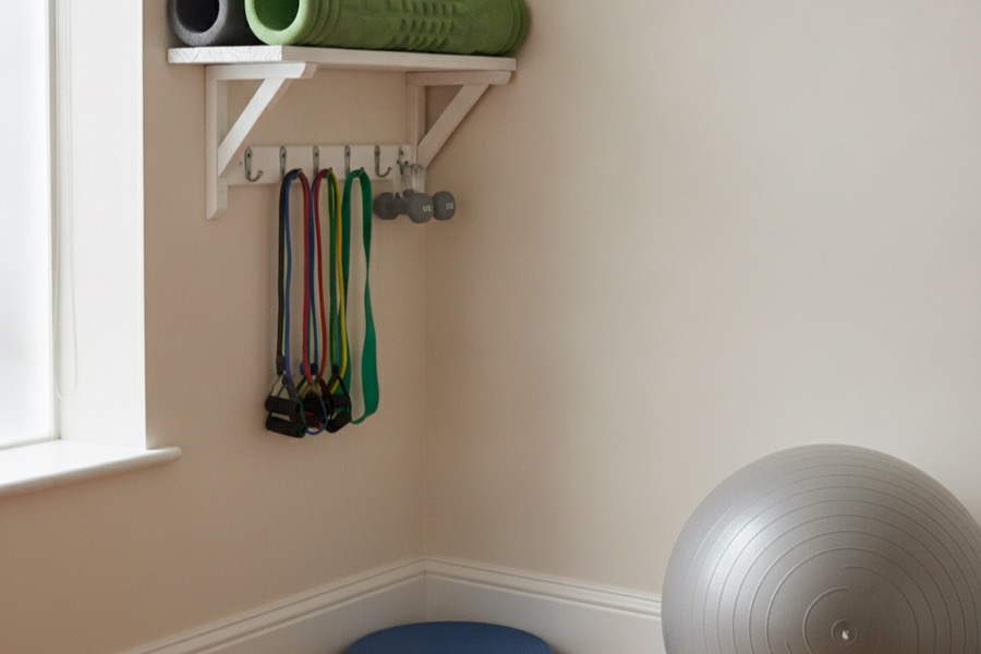 Rehab equipment: foam rollers, resistance bands and an exercise ball